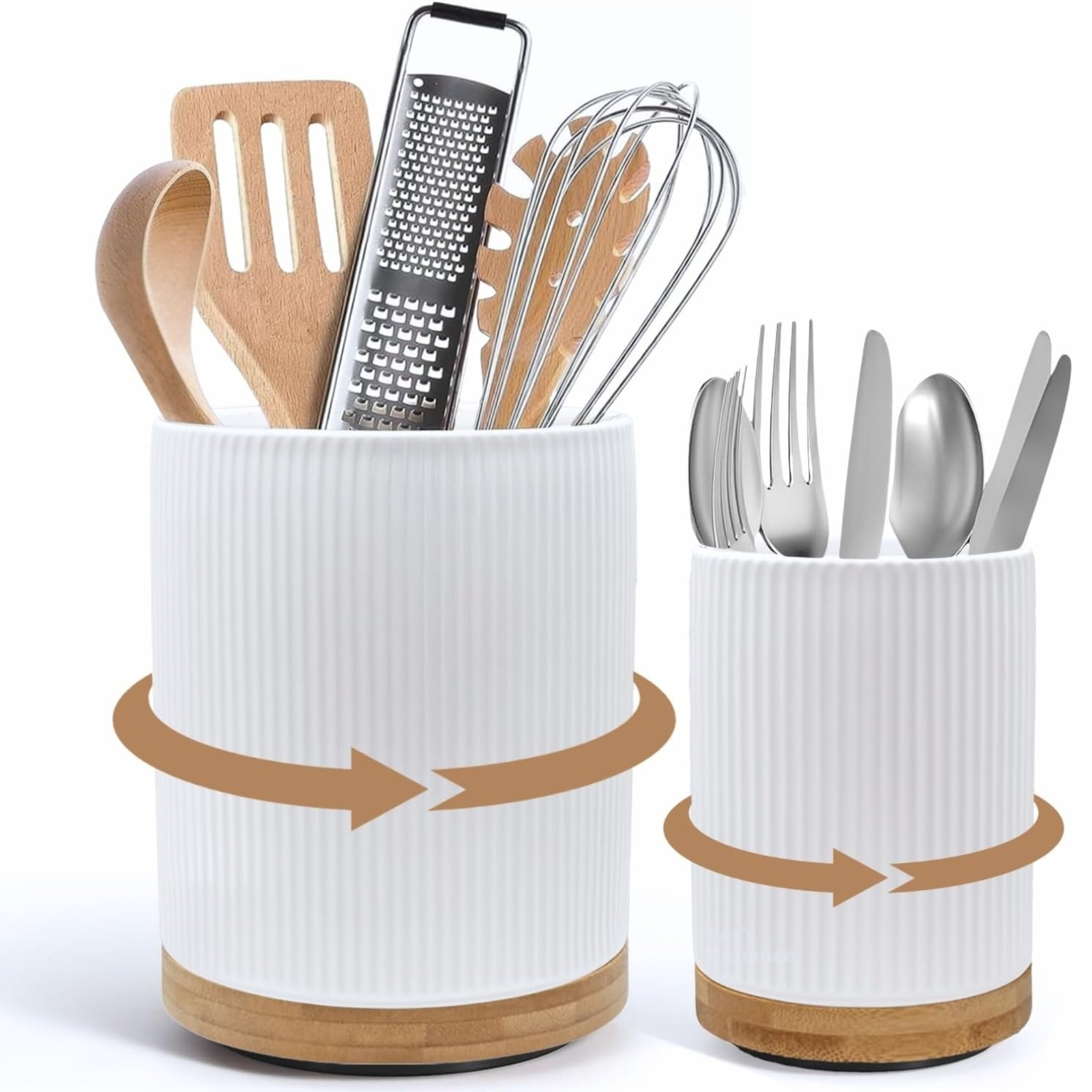 Two white fluted ceramic kitchen utensil holders in different sizes with rotating bamboo bases, containing wooden spatulas, a metal grater, and stainless steel cutlery.